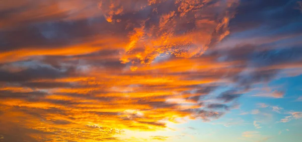 Sunset Clouds background. Dramatic Clouds Sunset Background. Sky with clouds in Sunrise. Sunrise with clouds in various shapes background. Calm Cloud