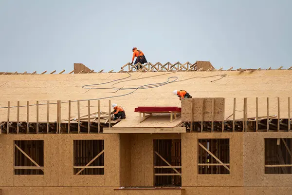 House roof. Roofing construction. Roofer using air nail. Roofing tiles of the new roof under construction building. Repairing building roof. Repair roofs, install roofing, renovate house. Frames roof