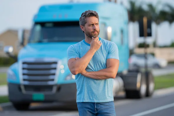 Hispanic driver near lorry truck. Man owner truck driver. Handsome hispanic man trucker trucking owner. Transportation industry vehicles. Handsome man driver front of truck