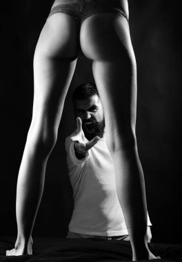 The nature of erotic desire. Bearded man shouting and looking at female in erotic underwear. Sensual couple playing adult erotic games. Erotic love is a deep feeling of sexual desire and attraction.