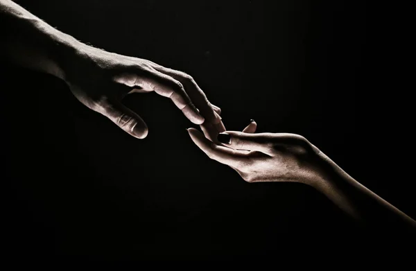 Hands at the time of rescue. Friendly handshake, friends greeting, teamwork, friendship. Tenderness, tendet touch
