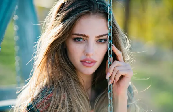 Young woman feels grateful, hopes for successful plan realization, believes in dream. Dreamy woman face