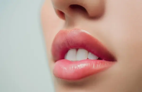 Sensual lips. Woman mouth with white teeth. White teeth, dental background. Tender lips. Close-up perfect natural lip