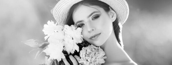 Beautiful young woman near blooming spring tree. Youth, love, fashion, romantic and lifestyle concept. Beautiful romantic young woman in spring flowers. Banner for header website design, copy space