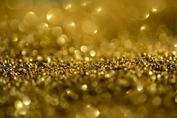 Gold glitter lights background. Gold Glitter backgrounds. Light Gold bokeh to design. Glitter Golds backgrounds for valentines day, birthday Christmas cards. Light abstract background. Golden light