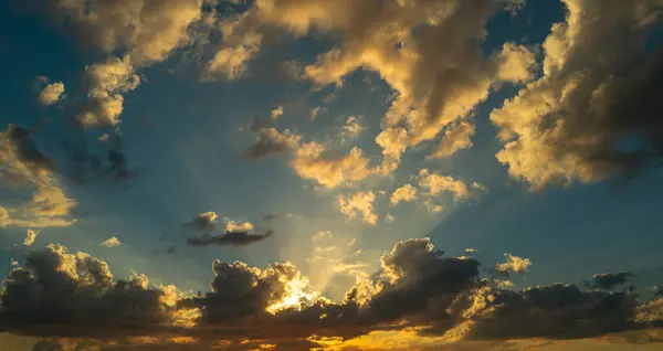 Clouds background. Dramatic Clouds Sunset Background. Sky with clouds in Sunrise. Sunrise with clouds in various shapes background. Calm Cloud