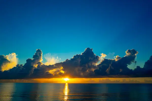 Dramatic sunset sky. sea. Calm sea with sunset sky through the clouds over. Sunset ocean and sky background. Tranquil seascape. Horizon over the sunset sea water. Calm sea with sunrise sky