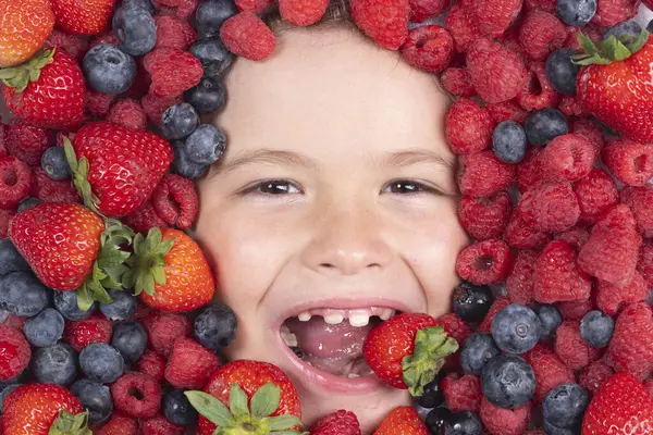 Berry banner. Berries mix blueberry, raspberry, strawberry, blackberry. Child face with berry frame, close up