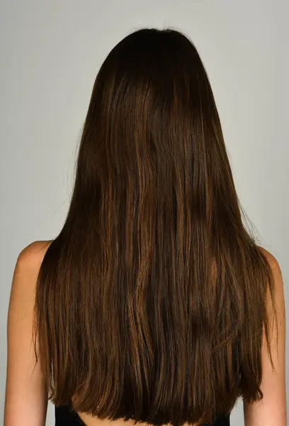 Woman hair back. Health long hair concept