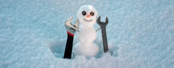 Snow man banner. Snowman in sunny winter cold day. Repairman with repair tools. Support repair and recover service