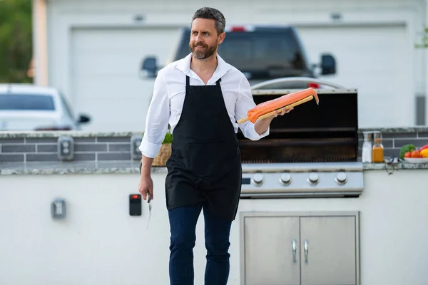 Male Chef Cook Apron Grilling Barbequing Salmon Fish Garden Handsome — Stock Photo, Image