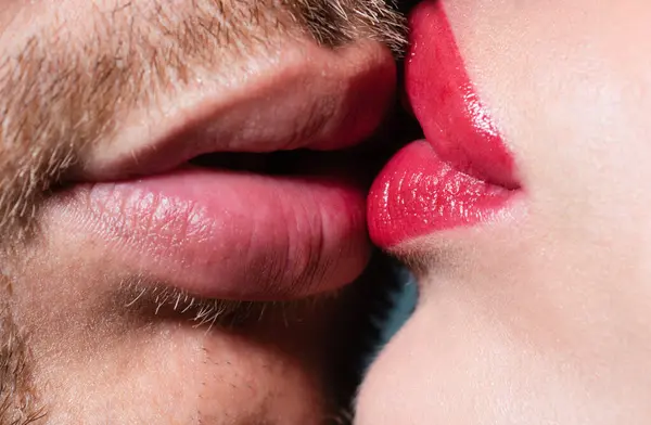 Sexy kiss with red lips. Close-up of beautiful passionate sexy couple kissing