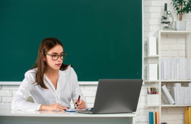 Portrait of female university student study lesson at school or university, online learning at school, distance education