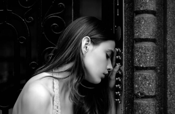 Woman intercom button. Lady female electronic doorbell at entrance. Young dress girl entering code on door keyboard