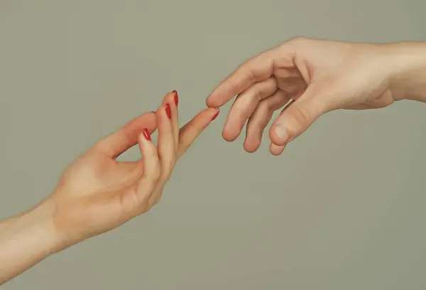 Touch of two hands. Man and woman hand about to touch with index finger. Couple in love reaching to each other. Hand try to touch. Couple hands reaching towards each other. Couple hand touch