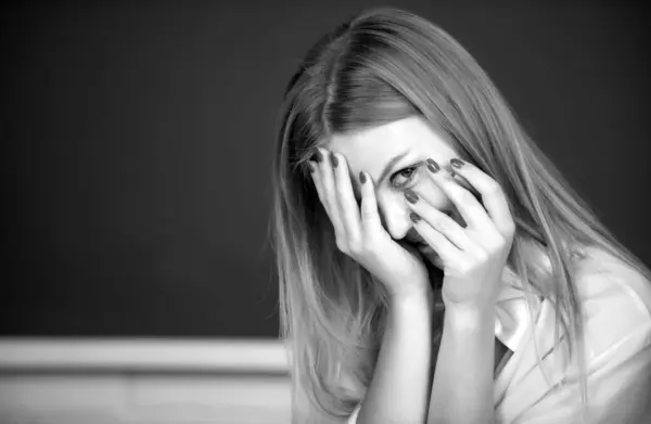 Portrait of young female college shame embarrassed student classroom on class with blackboard background