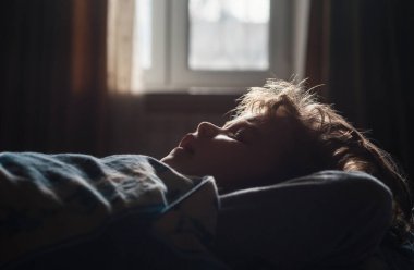 Little boy child sleeping in the bed. Quiet sleep