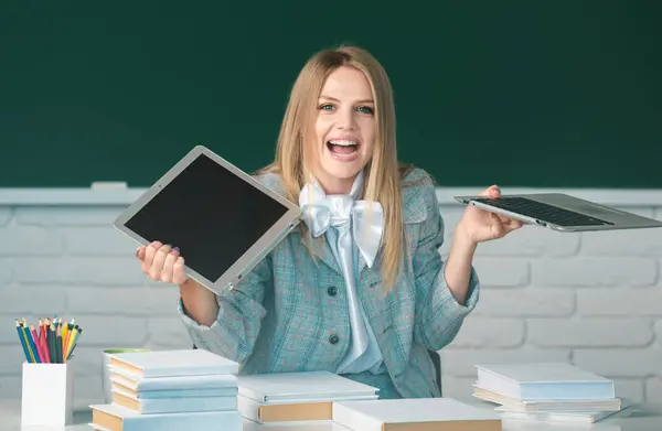 Portrait of a young, confident and attractive female student with cracked laptop. Failure, stress. Funny angry young student smashing mock up computer. Female breaks down laptop device