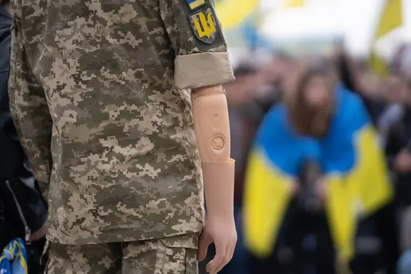 Stop war. Ukrainian veteran soldier. War in Ukraine. Military soldier. Support Ukraine soldiers. Russia Ukraine war, military protest. Ukrainian soldier veteran with human prosthetic arm