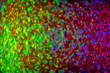 soyut ışıltı arka planı aydınlatır. Sanat ışıkları. Dekorasyon bokeh ışıldıyor, arkaplan bokeh ile soyut parlıyor. Sanat tasarımı arka planda bulanık efektli parıldayan kıvılcımlar oluşturur