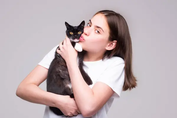 Cat with kissed girl. Cat and woman face. Pretty girl kiss The fluffy black cat. Cute kitty and beauty woman kissing. Love cat