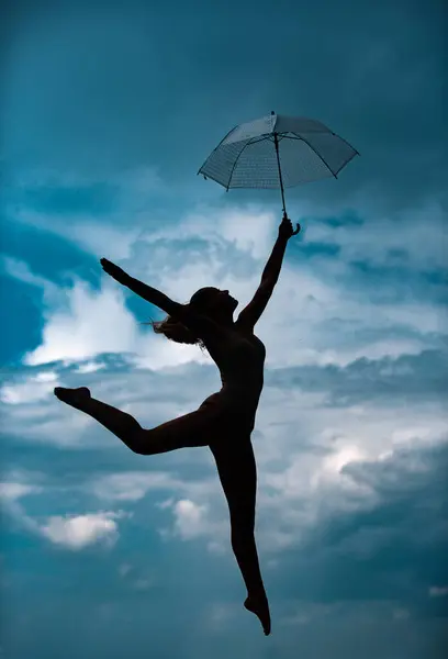 Silhouette Woman Umbrella Doing Stretching Exercise Outdoors Dance Studio — стоковое фото