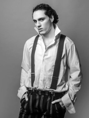 Handsome young man with serious expression on face. Handsome young man in shirt. Confident concept. Advertising for clothing store. Portrait casual serious man
