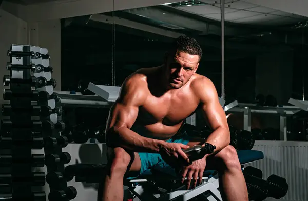 stock image Man drink water in gym. Healthy sport lifestyle. Sportsman resting after training