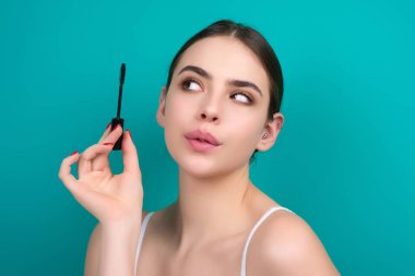 Perfect eyelashes. Natural beauty lashes. Eyelashes coloring and lamination. Woman combing lashes. Makeup and cosmetology concept. Eyelashes shape modeling clipart