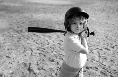 Boy kid posing with a baseball bat. Portrait of child playing baseball clipart