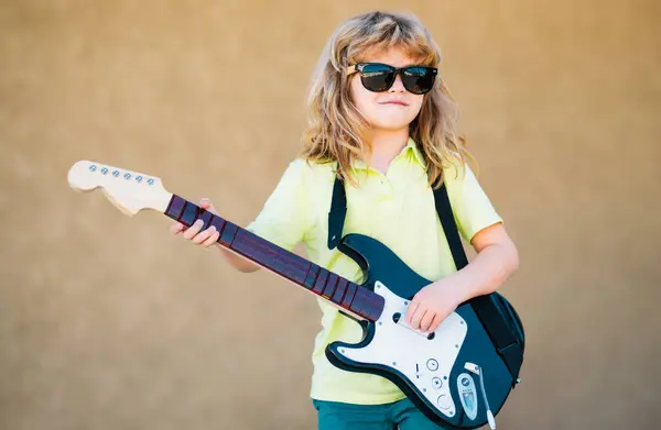 Funny Child Blonde Curly Hair Playing Guitar Beige Yellow Background — Stock Photo, Image