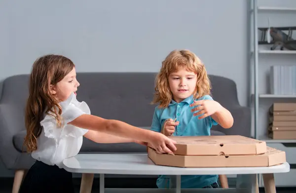 Children open pizza box at home. Kids preparing to eat pizza. Vegetarian fast Italian food, cute little kids enjoying delivery Pizza pepperoni, in cardboard box at home