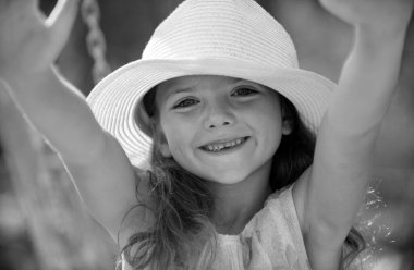 Smiling and laughing kids face closeup. Spring kids girl outdoor, child cute face. Summer vacation and happy childhood. Emotional portrait of a cheerful and positive smiling teen girl