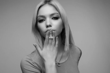 Beautiful portrait of young woman. Beautiful model posing in studio. Portrait of beautiful girl. Woman sensual face close up. Pretty beautiful girl portrait on studio background. Sensual look