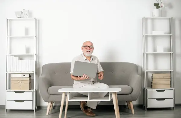 stock image Mature middle aged business man using laptop working on computer. Old businesswoman interviewing distance applicant, senior working job online