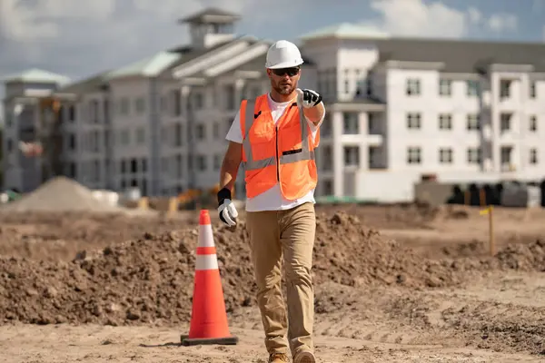 Portrait of american worker in construction helmet. Engineer builder foreman or repairman. Worker at building site. Construction manager in helmet. Male construction engineer. Handyman in hardhat