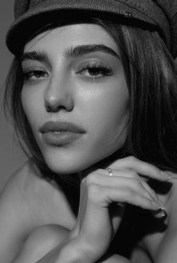 Beautiful portrait of young woman. Beautiful model posing in studio. Portrait of beautiful girl. Woman sensual face close up. Pretty beautiful girl portrait on studio background. Sensual look