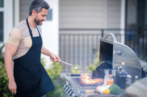 Barbecue Concept Middle Aged Hispanic Man Apron Barbecue Roasting Grilling Stock Image