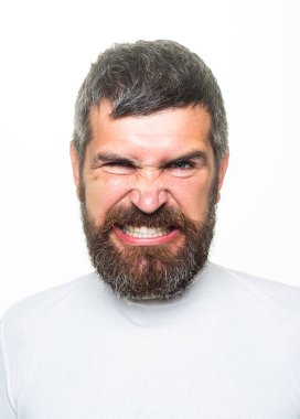 Man with angry expression. Angry hateful guy furious. Angry rage man face. Anger man with furious negative emotion portrait. Aggressive and mad bearded man bad behavior in studio