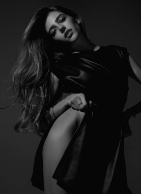 Sexy attractive woman with slim sexy body posing in fashion dress in studio. Beautiful sexy model portrait. Beauty woman face. Attractive sensual girl