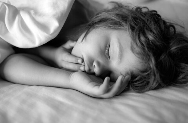 Little boy kids sleeping in bed. Kid sleep in bed