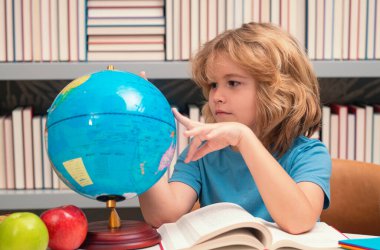 Child from elementary school with book. Little student, clever nerd pupil ready to study. First time to school. Concept of education and learning