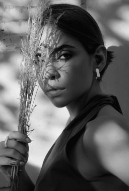 Romantic young woman posing near summer greenery outdoor. Country style. Sensual girl at countryside. Summer freedom lifestyle. Country hippie girl
