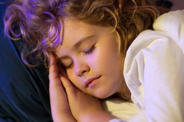 Good night sleep. Child sleeping in bed. Cute kid sleeping under blanket. Kid lying on pillow. Child rest asleep, enjoy healthy sleep or nap