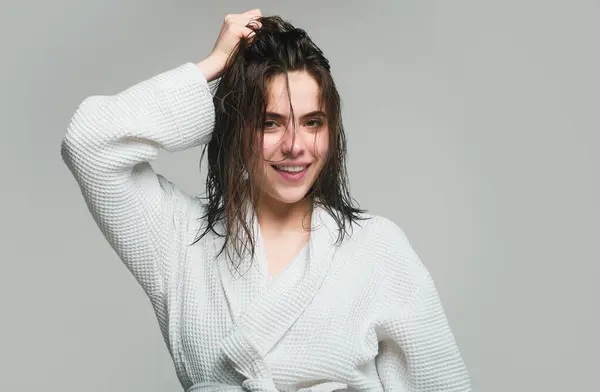 stock image Beautiful caucasian woman posing with wet hair. Girl applying hair conditioner