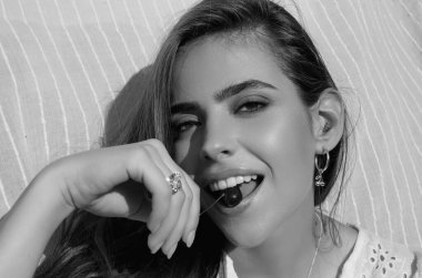 Romantic young woman posing near summer greenery outdoor. Country style. Sensual girl at countryside. Summer freedom lifestyle. Country hippie girl