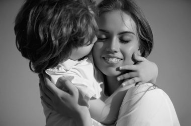 Mothers love. Closeup portrait of mother and child kissing. Mother hugging and embracing son. Mothers day, love family. Mother and child with tenderness. Mothers kiss child, cuddle warm relationships