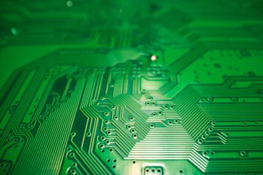 Electronic circuit board with semiconductors chip. Electronic motherboard card. Circuitry and close-up on electronics. Background of electronics on board electrical circuits, technology texture