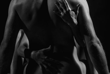 Sensual passionate couple enjoying tenderness and intimacy. Young sexy couple. Romantic lovers. Portrait of a sensual couple in love. Young sexy couple embracing. Loving coupl hugging