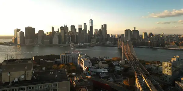 stock image Panoramic cityscape about Manhattans skyscrapers. Manhattan skyline. Manhattan Buildings. New York Skyline. Brooklyn and Manhattan Bridge. Aerial view of Manhattan in New York City